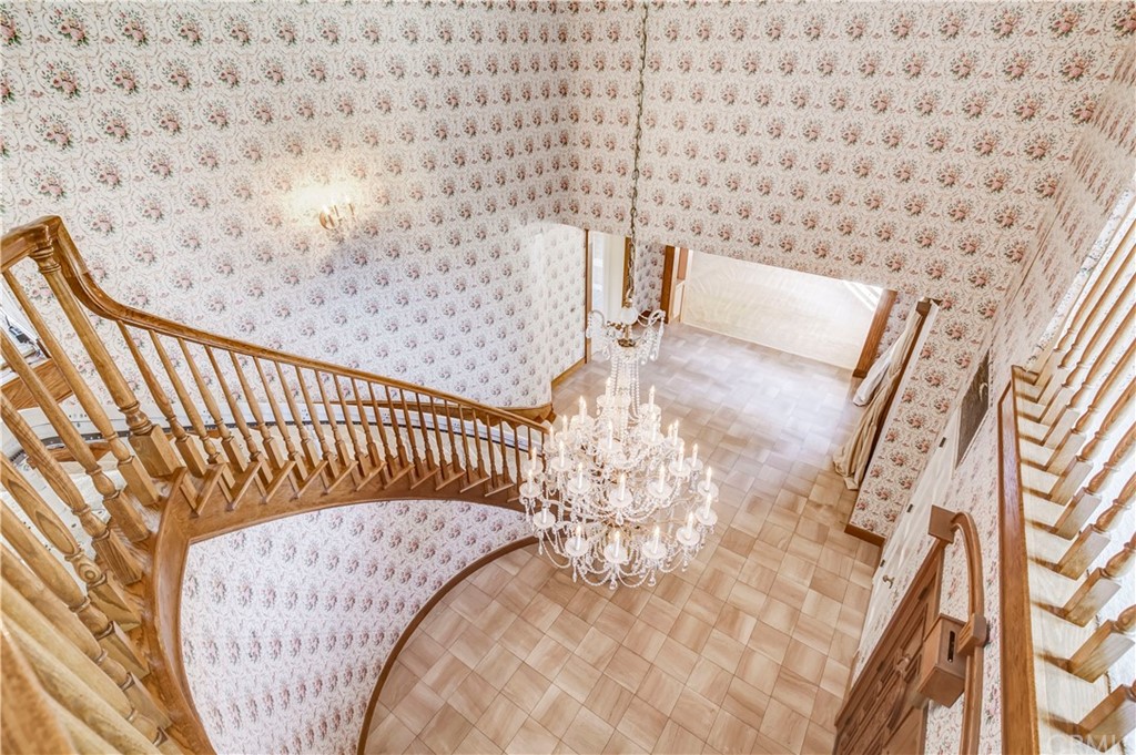 1632 Smiley Heights Drive Redlands, CA 92373 - Photo 28 of 75 a bed sitting in a bedroom next to a white wall