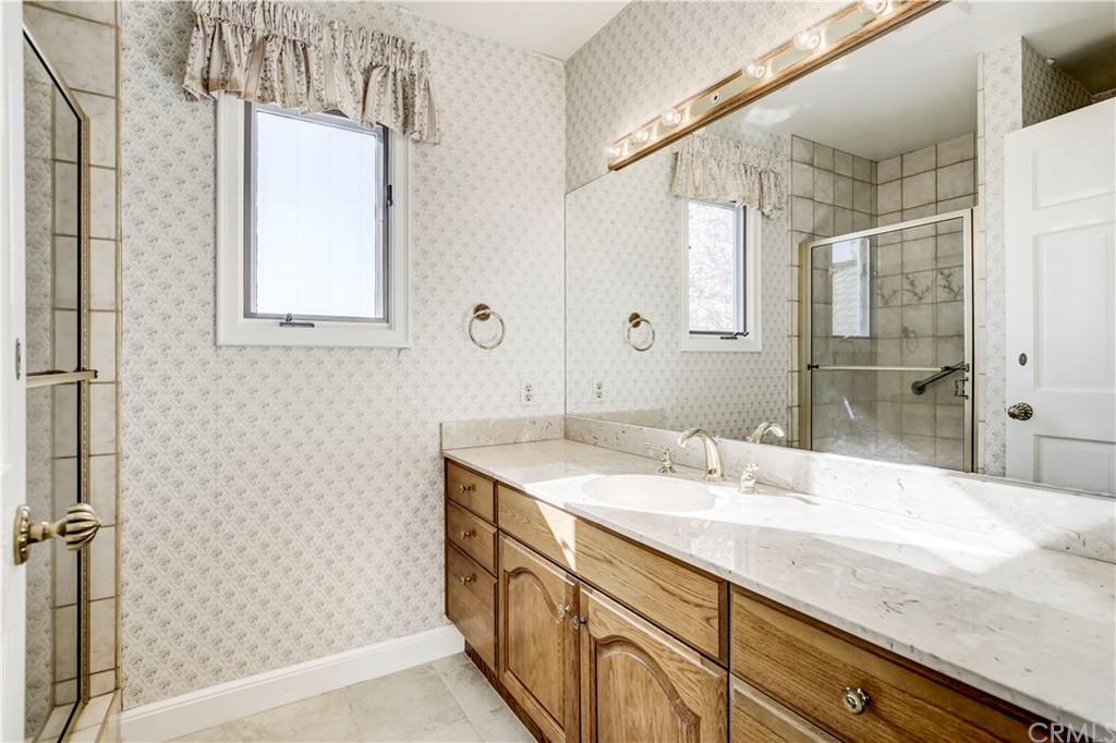 1632 Smiley Heights Drive Redlands, CA 92373 - Photo 32 of 75 a bathroom with a granite countertop sink mirror and double