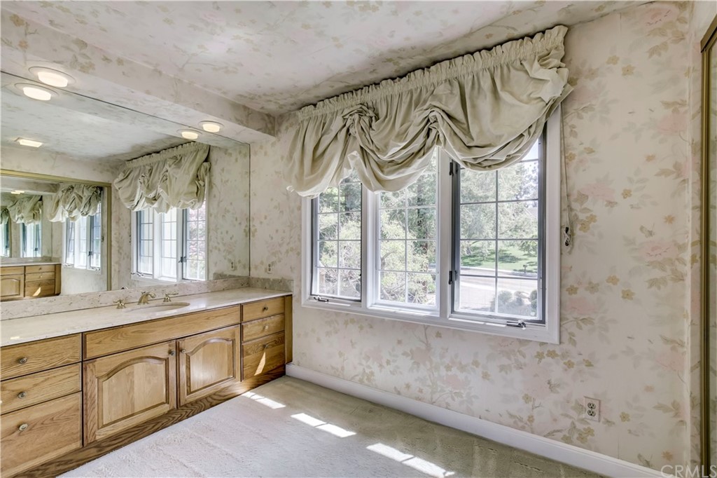 1632 Smiley Heights Drive Redlands, CA 92373 - Photo 38 of 75 a spacious bathroom with a granite countertop sink mirror and a shower