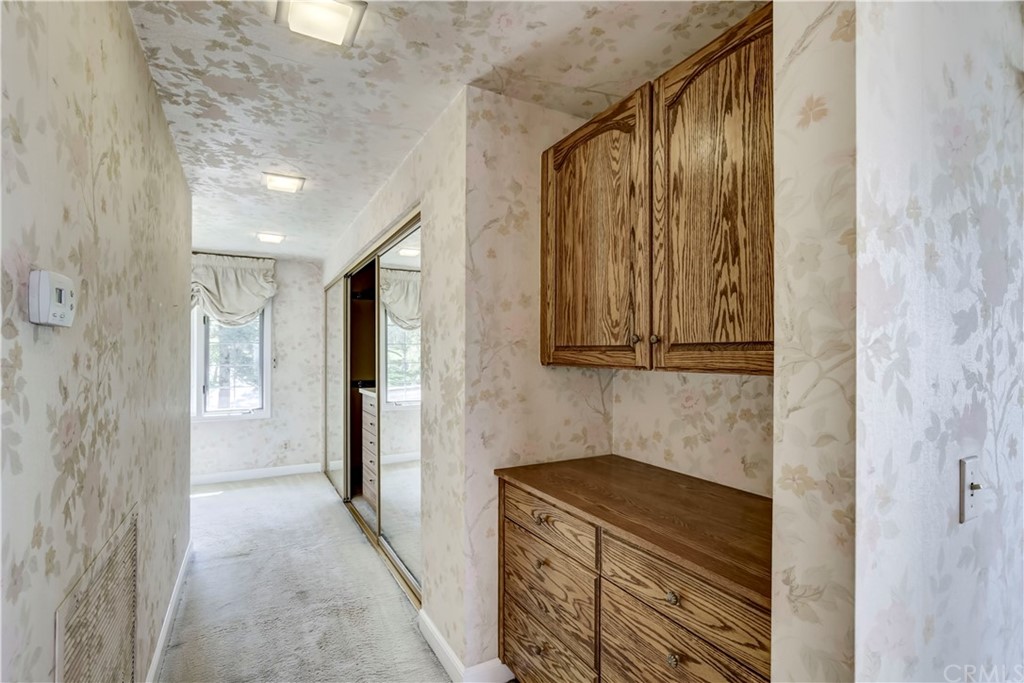 1632 Smiley Heights Drive Redlands, CA 92373 - Photo 41 of 75 a bathroom with a granite countertop sink and a mirror