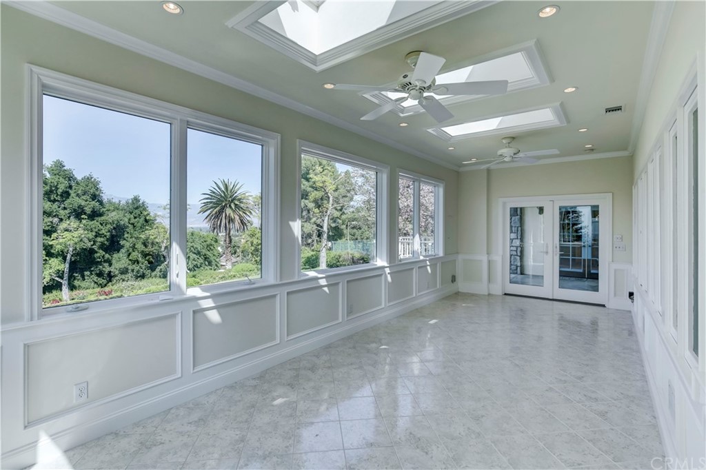 1632 Smiley Heights Drive Redlands, CA 92373 - Photo 53 of 75 a view of an empty room with wooden floor and a window