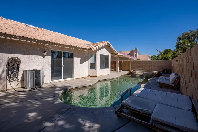 a view of swimming pool having outdoor seating