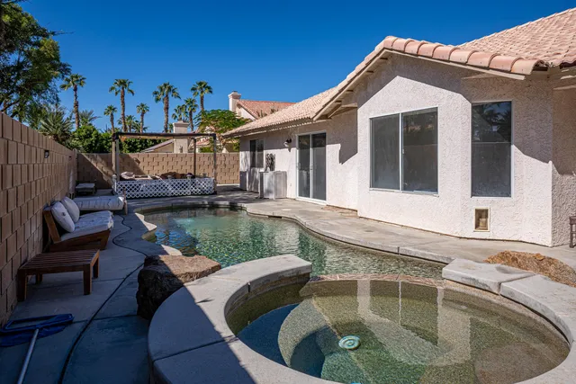a view of a chairs and table in the patio