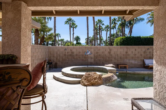 a bathroom with double sink and a mirror