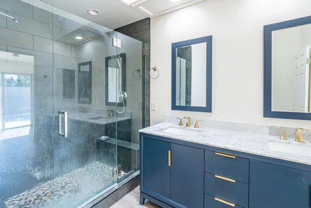 an empty room with closet and a ceiling fan