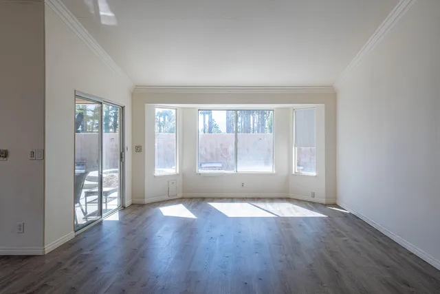 a kitchen with stainless steel appliances granite countertop a refrigerator a sink and a stove