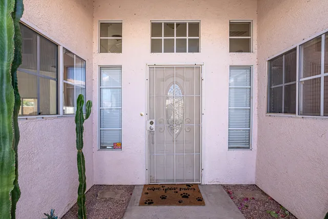 a view of a house with backyard and porch