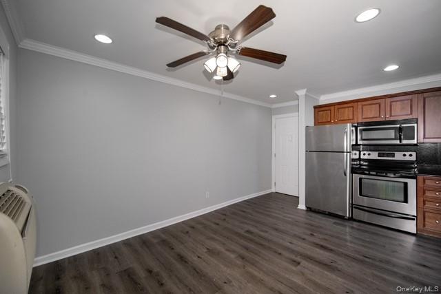 387 C Great East Neck Road, Unit 387C West Babylon, NY 11704 - Photo 5 of 9 a view of kitchen with stainless steel appliances wooden floor and a stove top oven