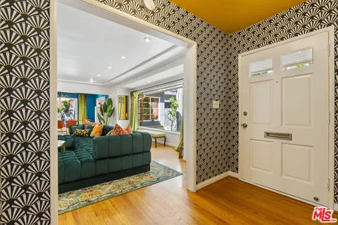 a living room with furniture and a gate