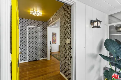 a view of a bathroom with a shower curtain and a dining table