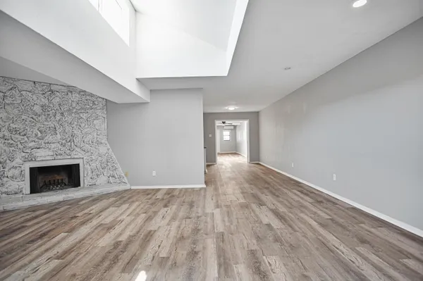 a view of an empty room with a window
