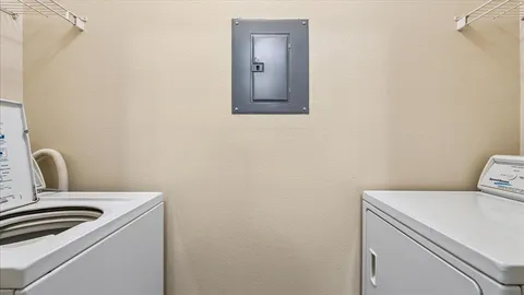 a bathroom with a toilet sink vanity and mirror