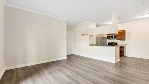 a view of kitchen with sink microwave and stove