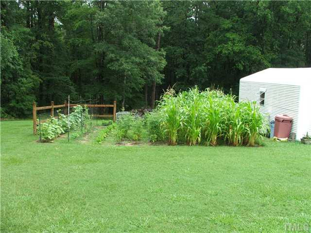 222 Santee Road Durham, NC 27704 - Photo 19 of 21 There is a worshop with bench, storage and electricity, as well as an extra shed for storage. Workshop