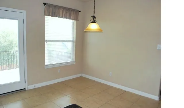 a view of a livingroom with a ceiling fan and window