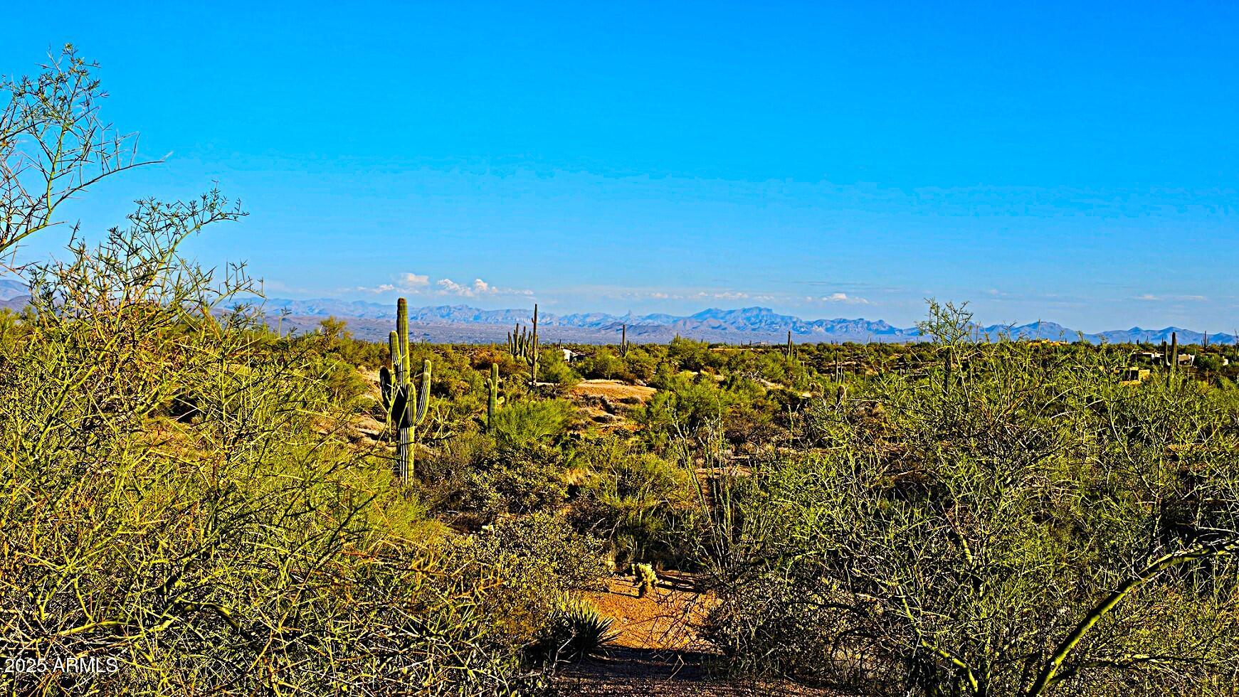 142-x2 East Montello Road Scottsdale, AZ 85262 - Photo 15 of 39 a view of a large body of water with a building in the background