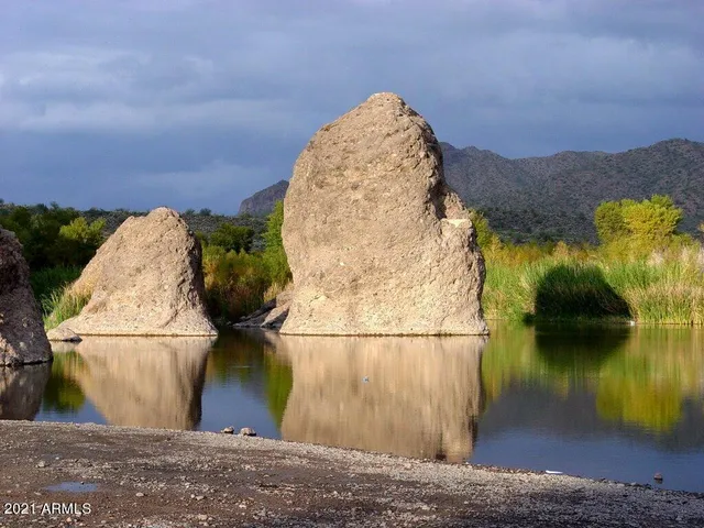 a picture of a bathroom with a shower and a mirror