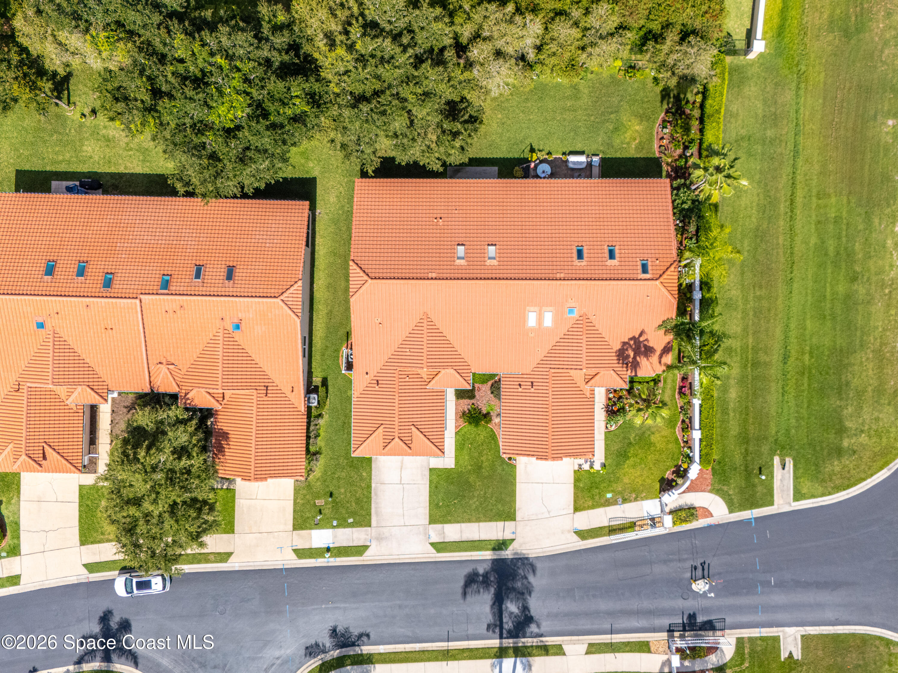 598 Renaissance Avenue Melbourne, FL 32940 - Photo 47 of 56 an aerial view of a house with a yard