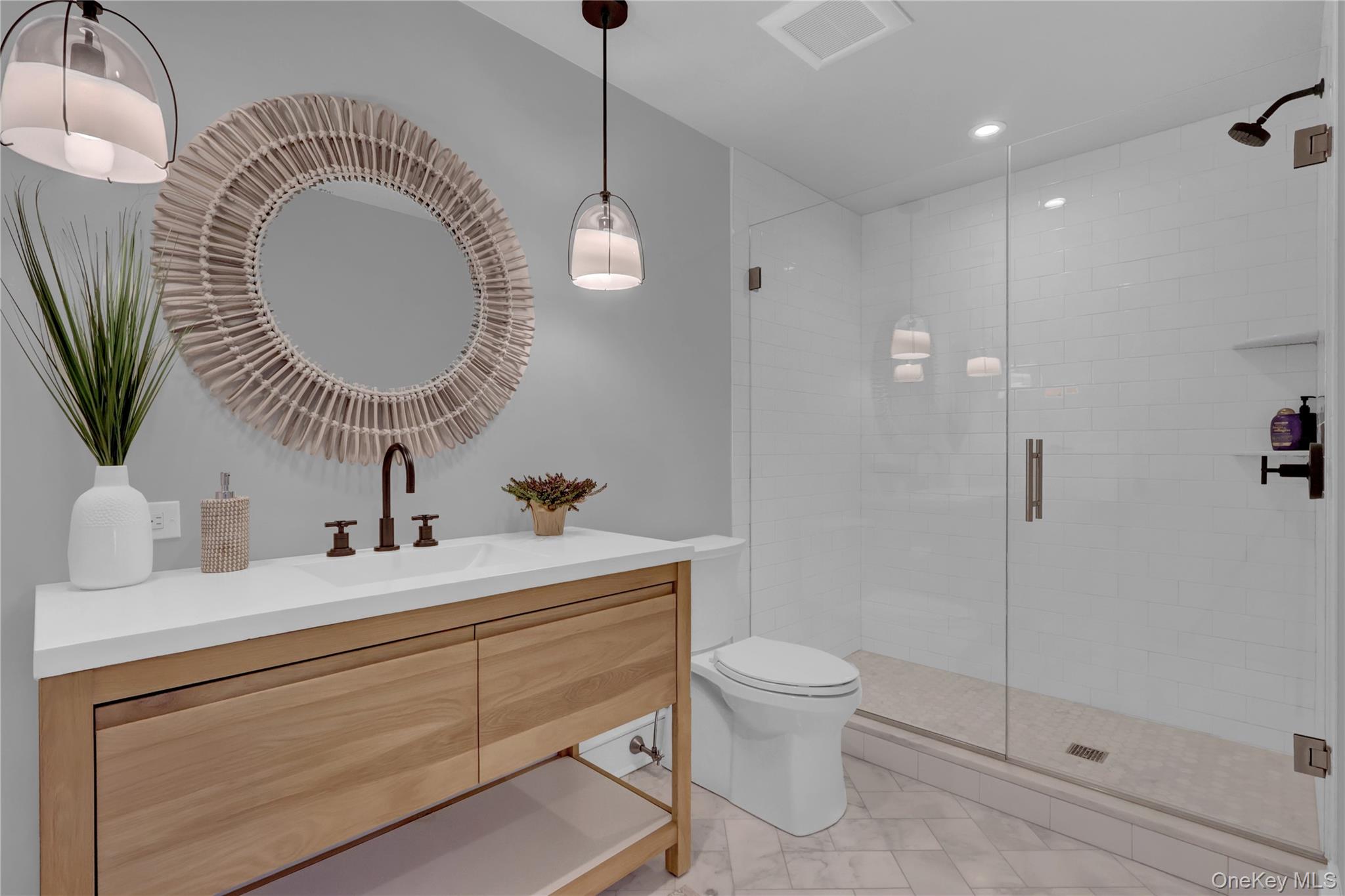 99 Parkside Drive Point Lookout, NY 11569 - Photo 28 of 50 a bathroom with a toilet a sink and mirror