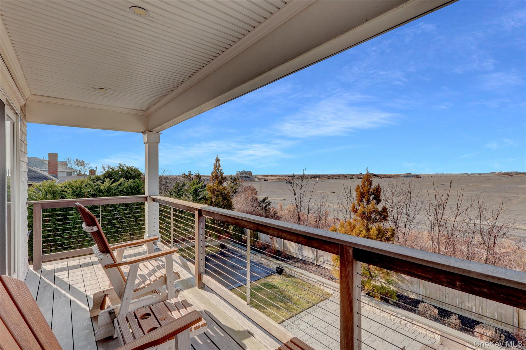 99 Parkside Drive Point Lookout, NY 11569 - Photo 31 of 50 a view of a balcony with wooden floor and fence