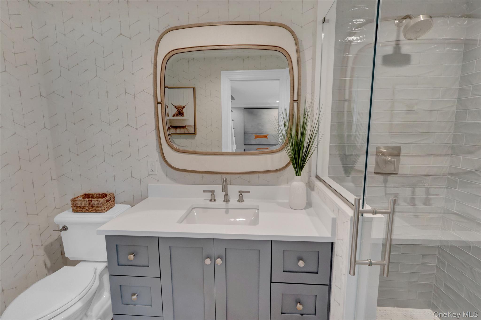 99 Parkside Drive Point Lookout, NY 11569 - Photo 46 of 50 a bathroom with a sink a toilet and mirror