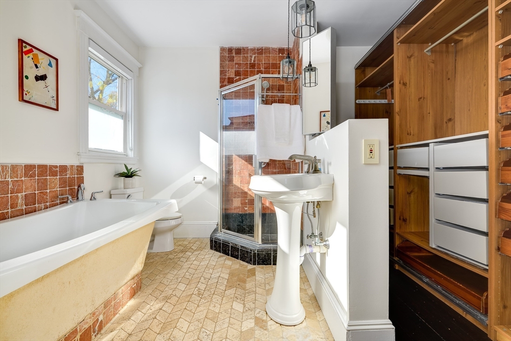 161 Columbia Street, Unit 3 Cambridge, MA 02139 - Photo 12 of 19 a living room with a bed furniture and a kitchen view