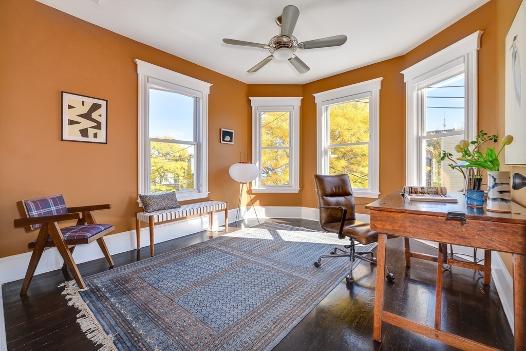 161 Columbia Street, Unit 3 Cambridge, MA 02139 - Photo 13 of 19 a living room with furniture and a large window