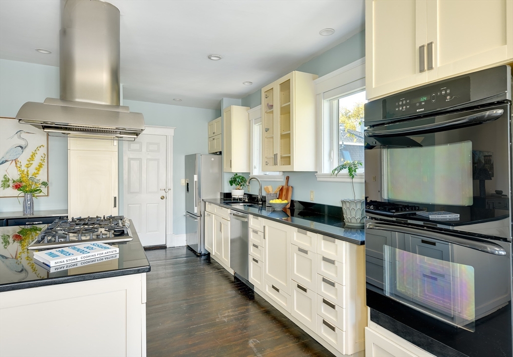 161 Columbia Street, Unit 3 Cambridge, MA 02139 - Photo 7 of 19 a kitchen with stainless steel appliances a stove sink and cabinets