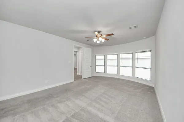 a view of an empty room with a window