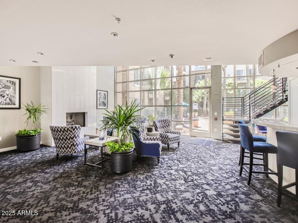 1701 East Colter Street, Unit 370 Phoenix, AZ 85016 - Photo 15 of 20 a living room with furniture and a potted plant