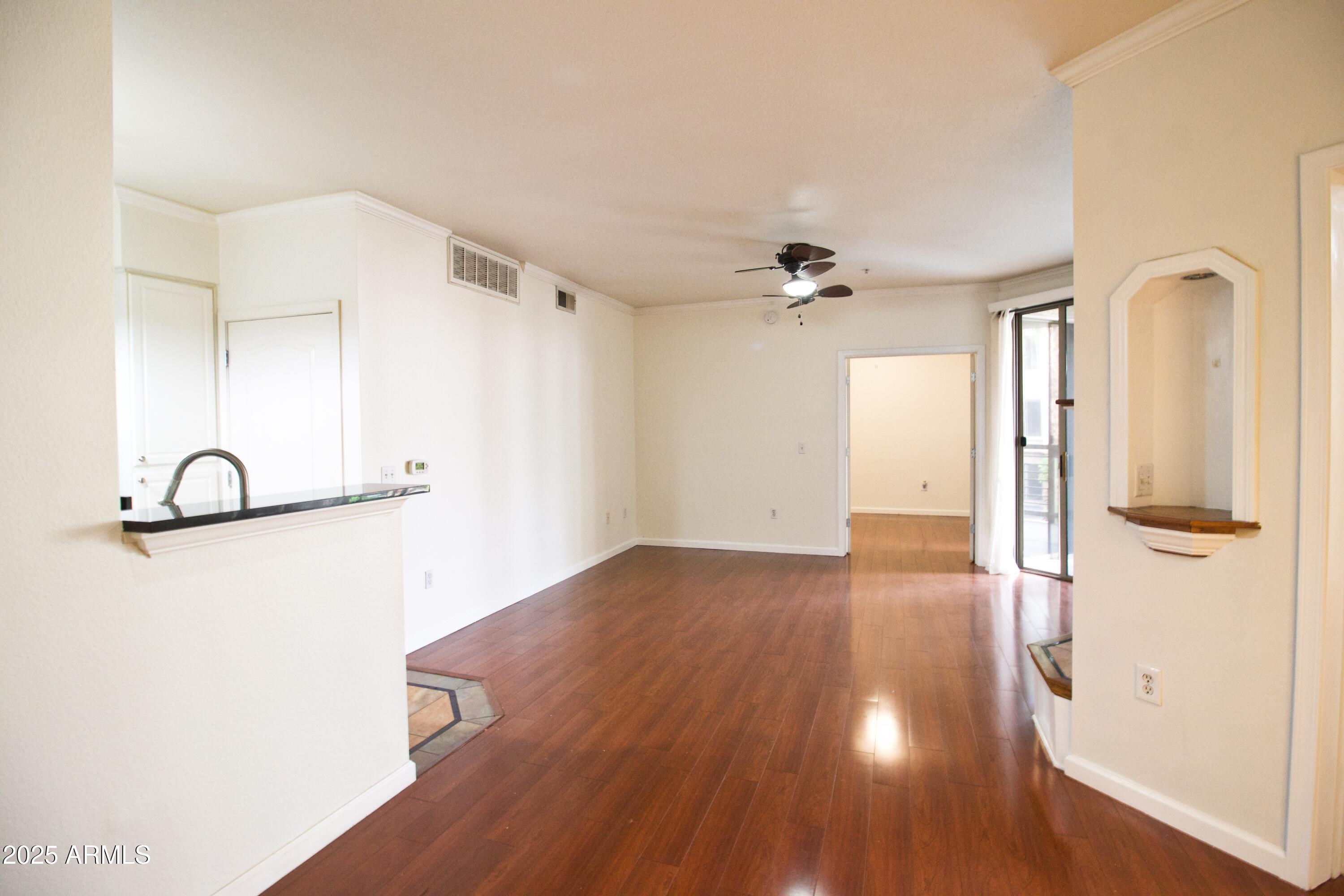 1701 East Colter Street, Unit 370 Phoenix, AZ 85016 - Photo 2 of 20 a view of a livingroom with wooden floor