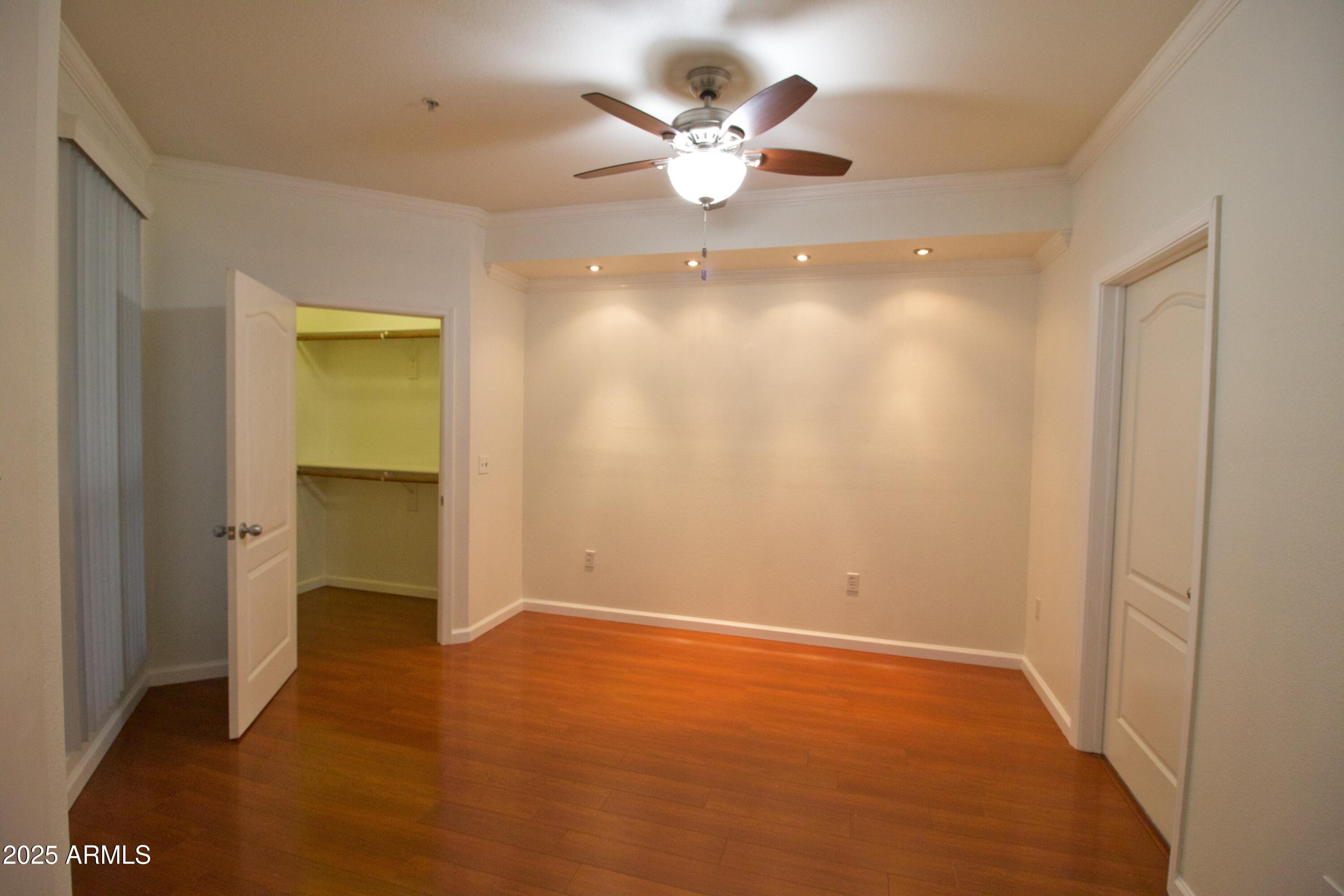 1701 East Colter Street, Unit 370 Phoenix, AZ 85016 - Photo 8 of 20 a view of an empty room with a ceiling fan