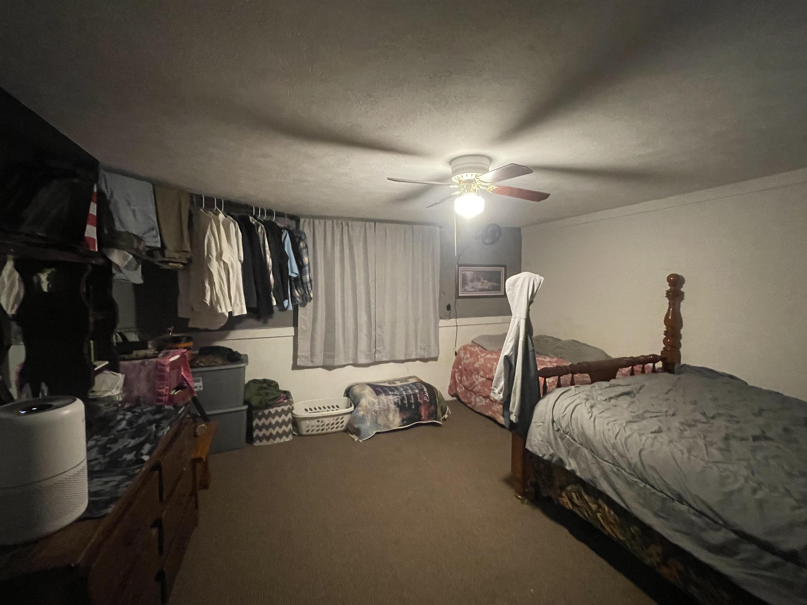 1740 Cr 187 Road Waterloo, AL 35677 - Photo 5 of 18 a bedroom with bed a lamp and a flat tv screen