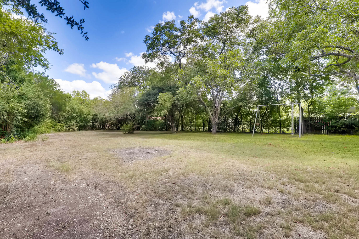 446 Pike Road San Antonio, TX 78209 - Photo 26 of 28 A spacious backyard with mature trees provides ample room for recreation and relaxation.