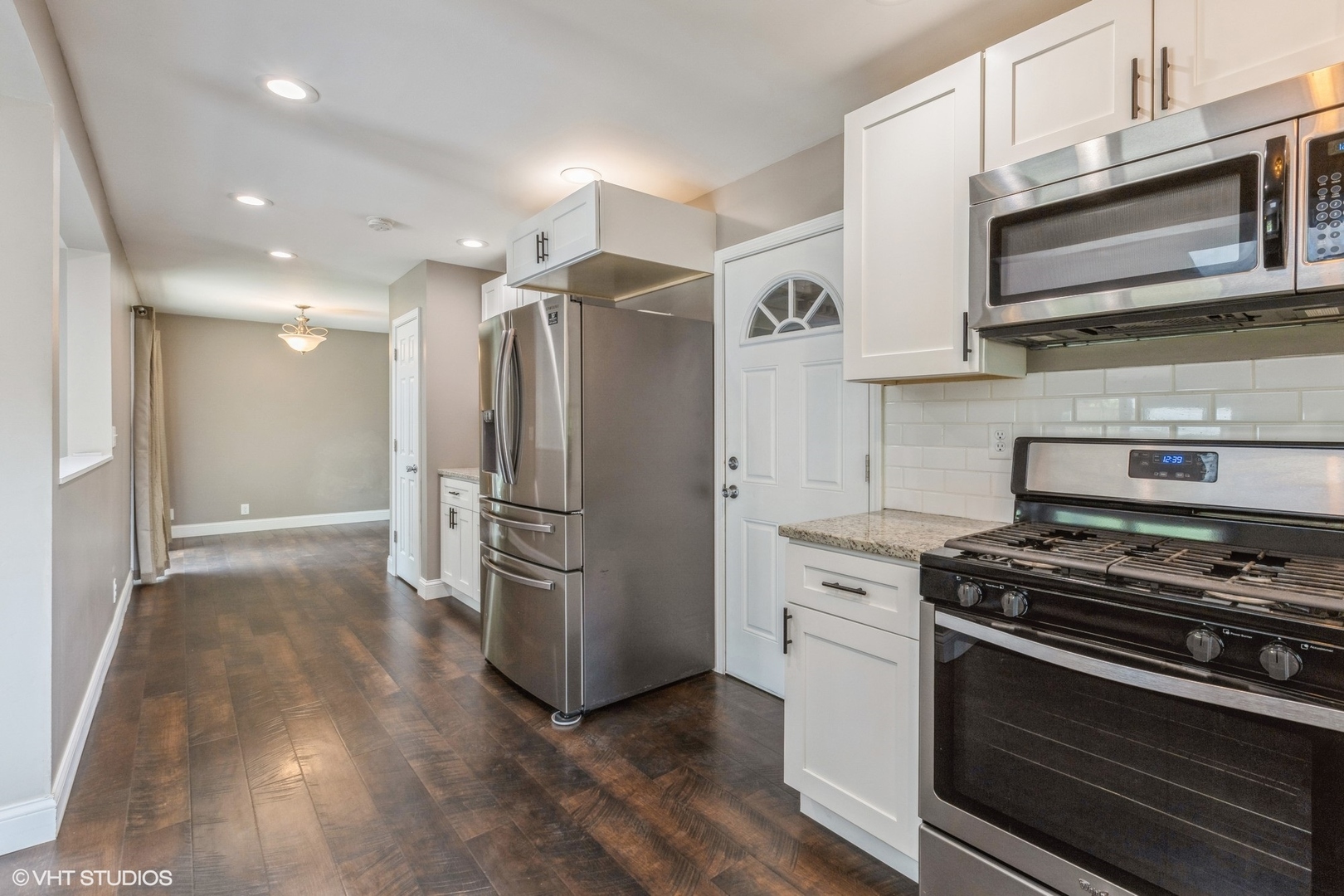13 Briarcliff Road Montgomery, IL 60538 - Photo 7 of 16 a kitchen with stainless steel appliances a refrigerator stove and microwave