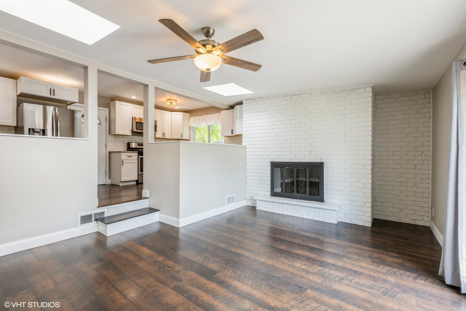 13 Briarcliff Road Montgomery, IL 60538 - Photo 8 of 16 a view of a room with wooden floor and a ceiling fan
