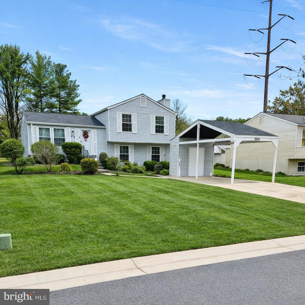 6915 Bugledrum Way Columbia, MD 21045 - Photo 1 of 25 a front view of house with yard and green space