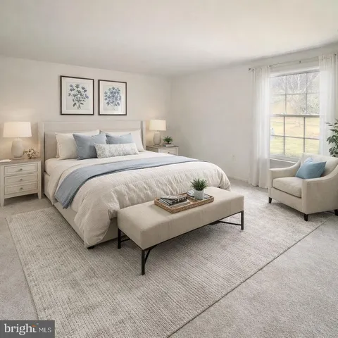 a spacious bedroom with a bed and a couch