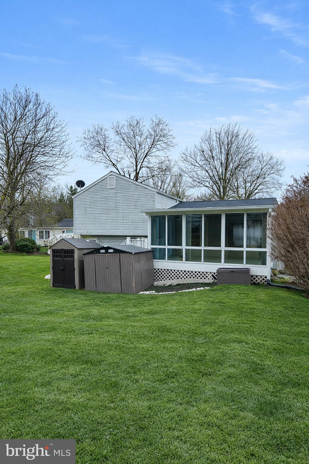 6915 Bugledrum Way Columbia, MD 21045 - Photo 23 of 25 a view of a house with a yard and sitting area