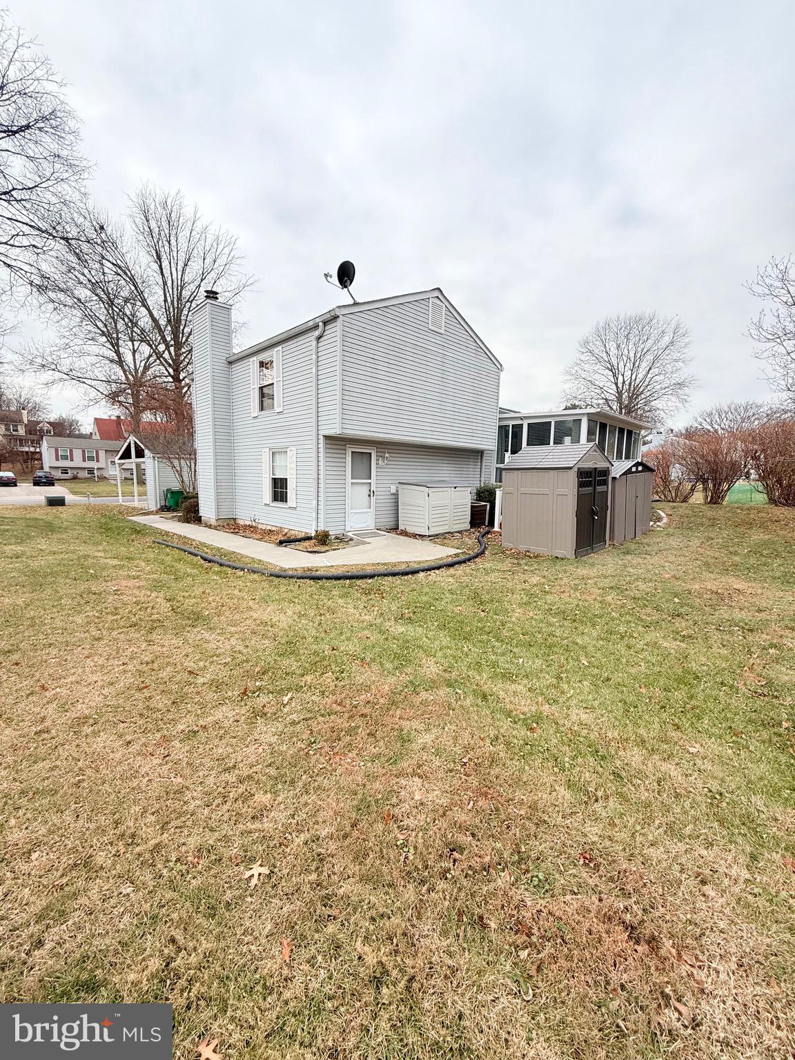 6915 Bugledrum Way Columbia, MD 21045 - Photo 25 of 25 a view of a house with a yard and sitting area