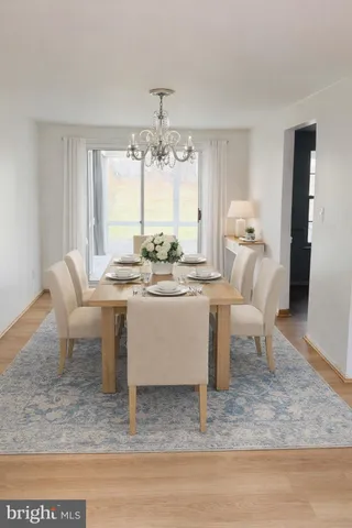 a room with a piano table and chairs