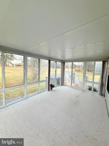 a view of an empty room with a large window