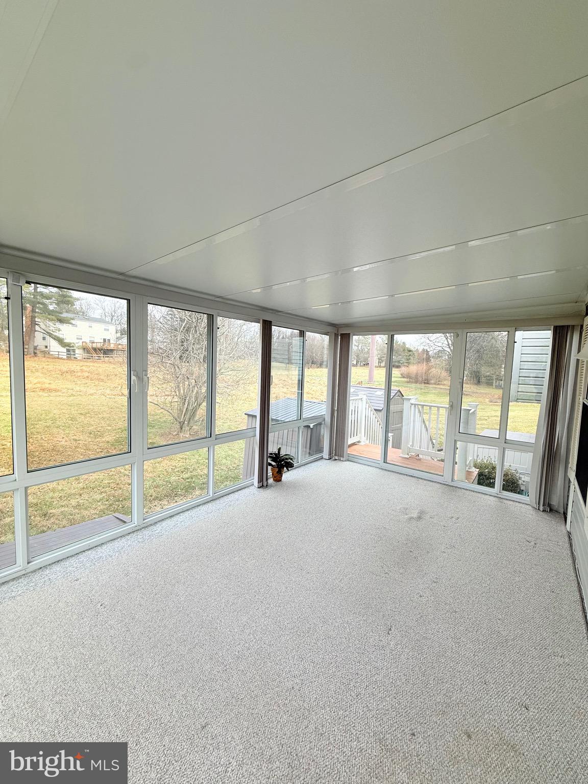 6915 Bugledrum Way Columbia, MD 21045 - Photo 9 of 25 a view of an empty room with a large window