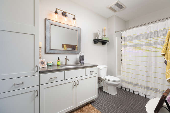 17 Windward Way Ottawa, IL 61350 - Photo 37 of 48 a bathroom with a toilet sink a mirror and shower