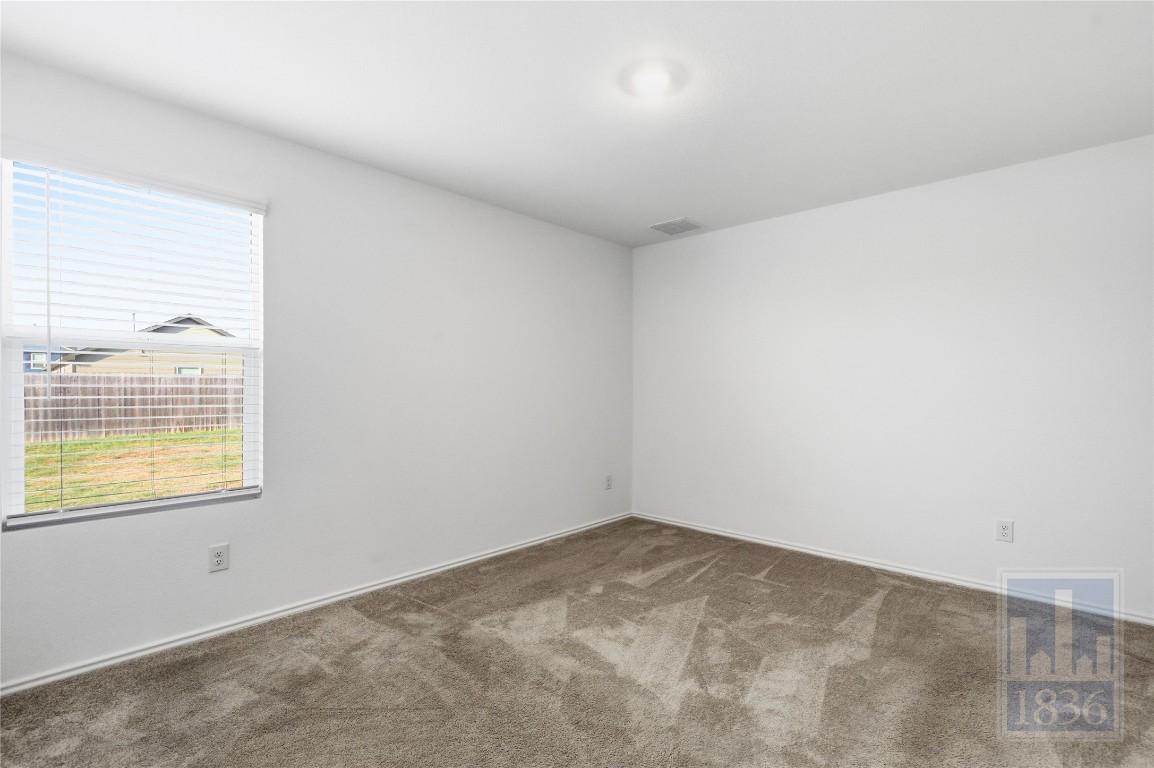 2213 Cyclone Drive Lockhart, TX 78644 - Photo 11 of 26 an empty room with a window