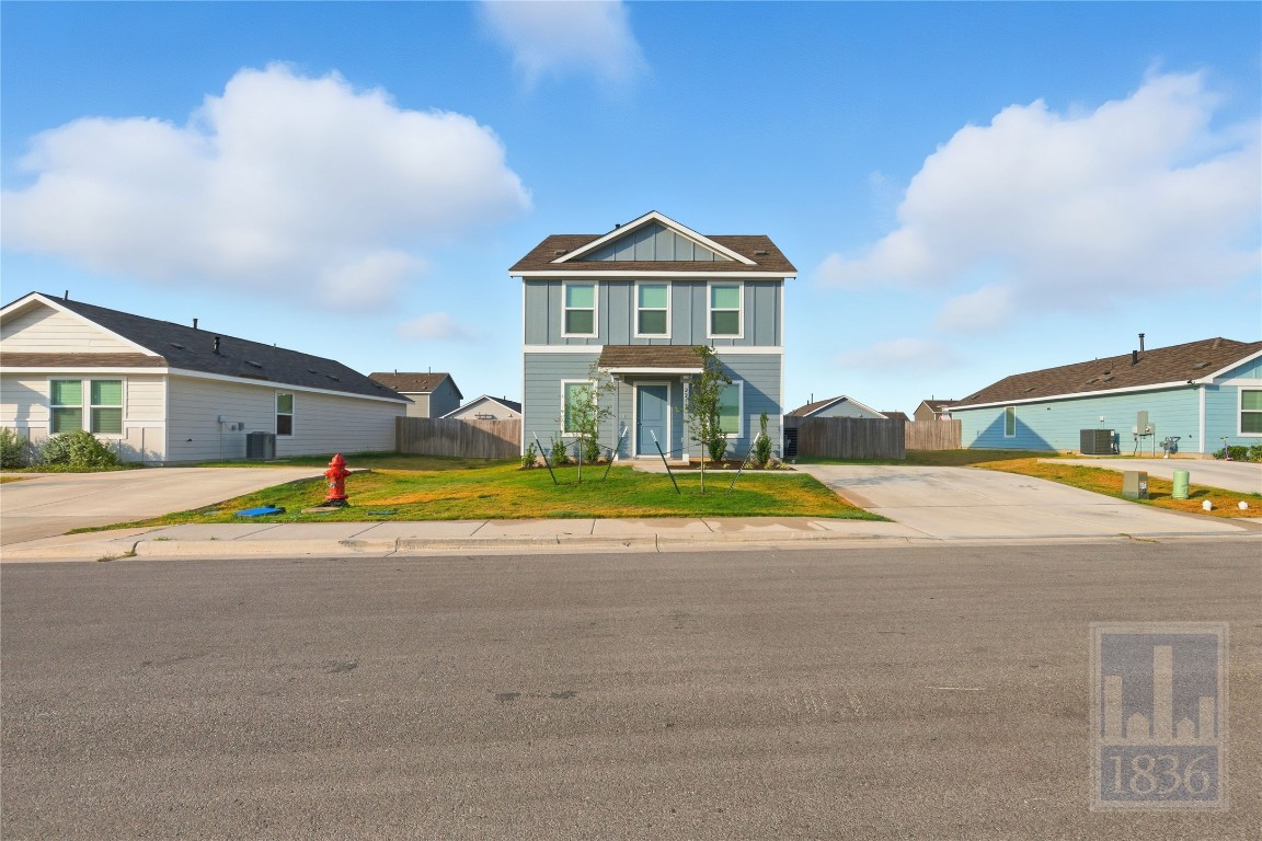 2213 Cyclone Drive Lockhart, TX 78644 - Photo 25 of 26 a view of a house with a swimming pool