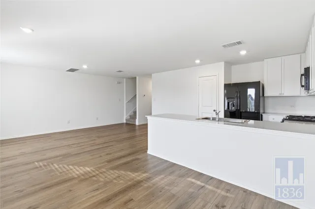 a view of kitchen with wooden floor