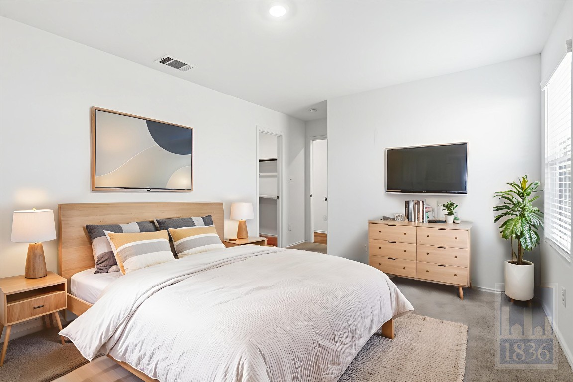 2213 Cyclone Drive Lockhart, TX 78644 - Photo 9 of 26 a bedroom with a bed and a flat screen tv