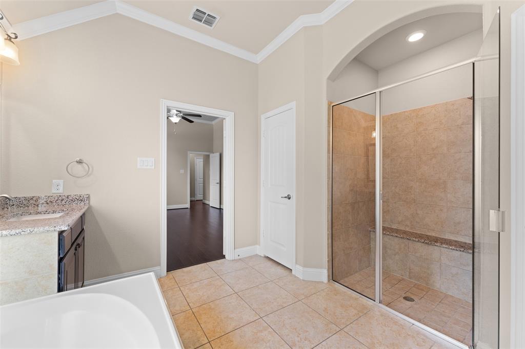 600 Fishback Circle Plano, TX 75074 - Photo 21 of 38 a bathroom with a granite countertop sink mirror and shower