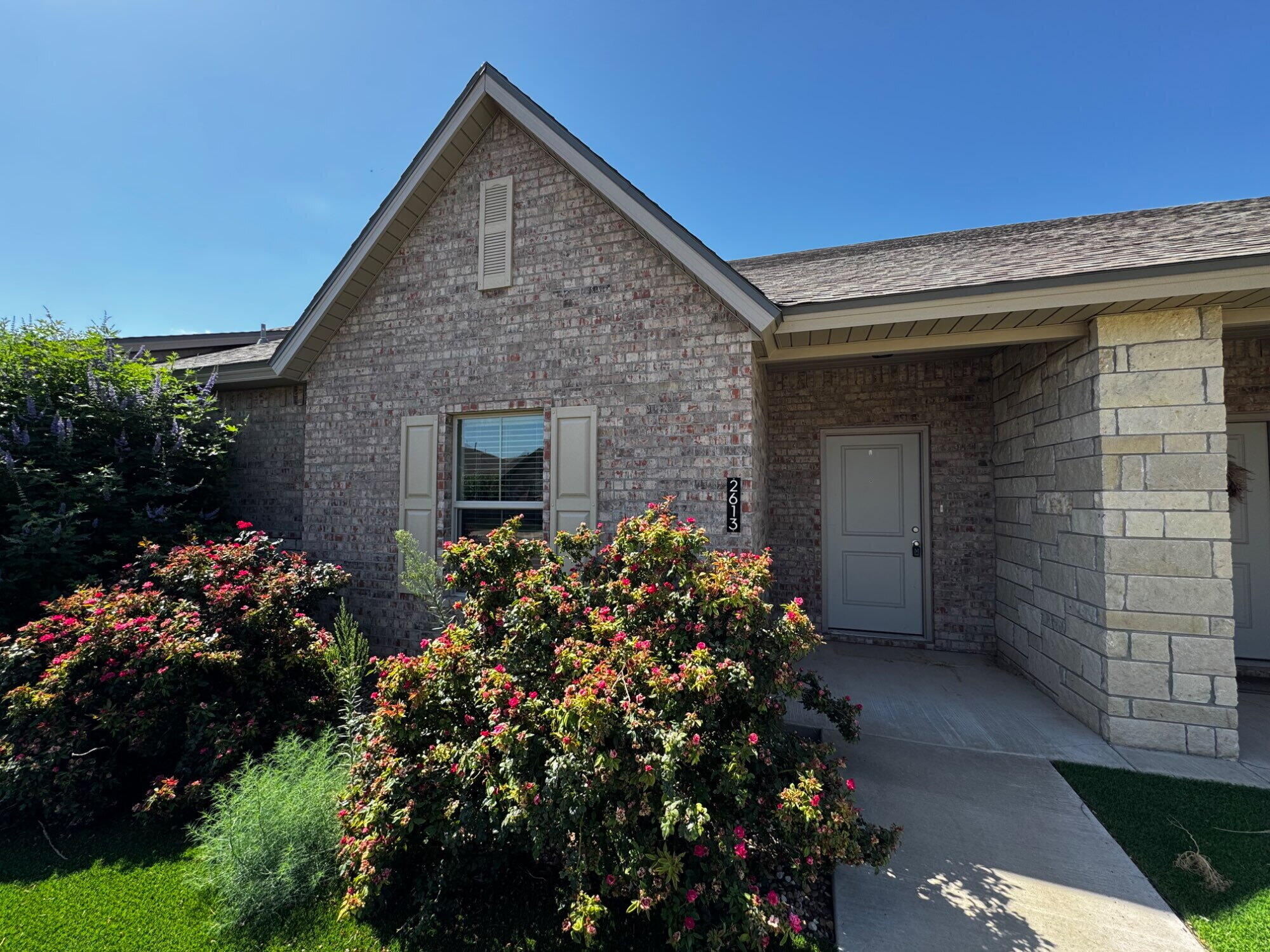 2613 135th Street Lubbock, TX 79423 - Photo 1 of 15 a front view of a house with a yard